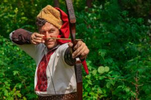 a man holding a bow and arrow