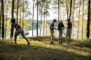 Group of children cleaning the forest