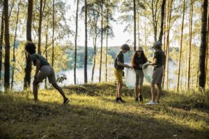 Group of children cleaning the forest 