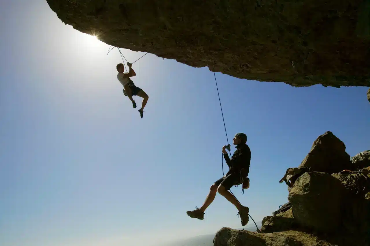 Rock Climbing Below A Boulder